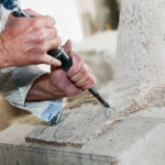 a master sculptor works marble to create a sculpture in Italy