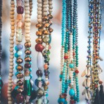 Women beads and necklace in jewerly market. Bali island. Asia.